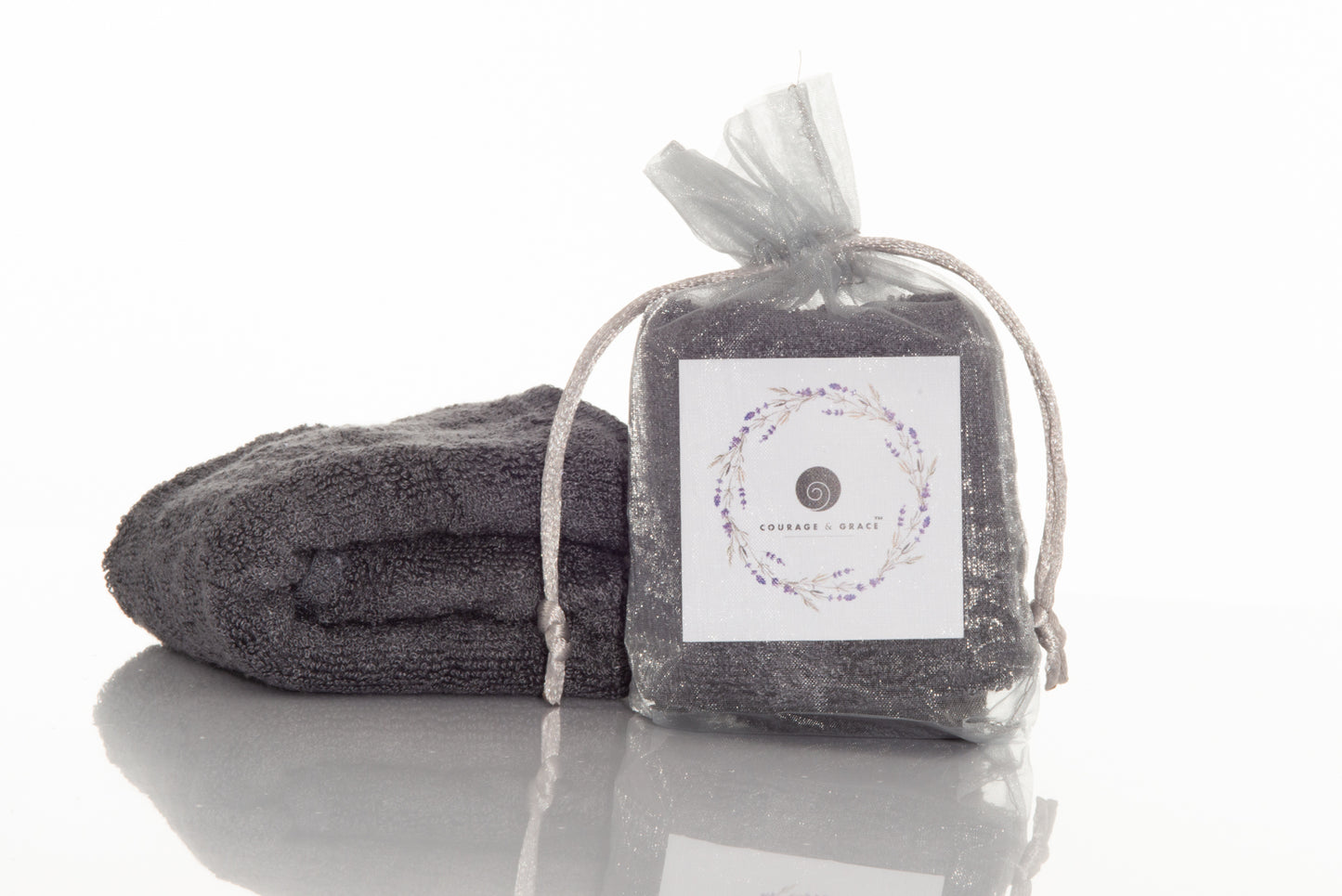 An image of Courage & Grace Body Care's slate grey colored organic bamboo washcloths for sensitive skin.
