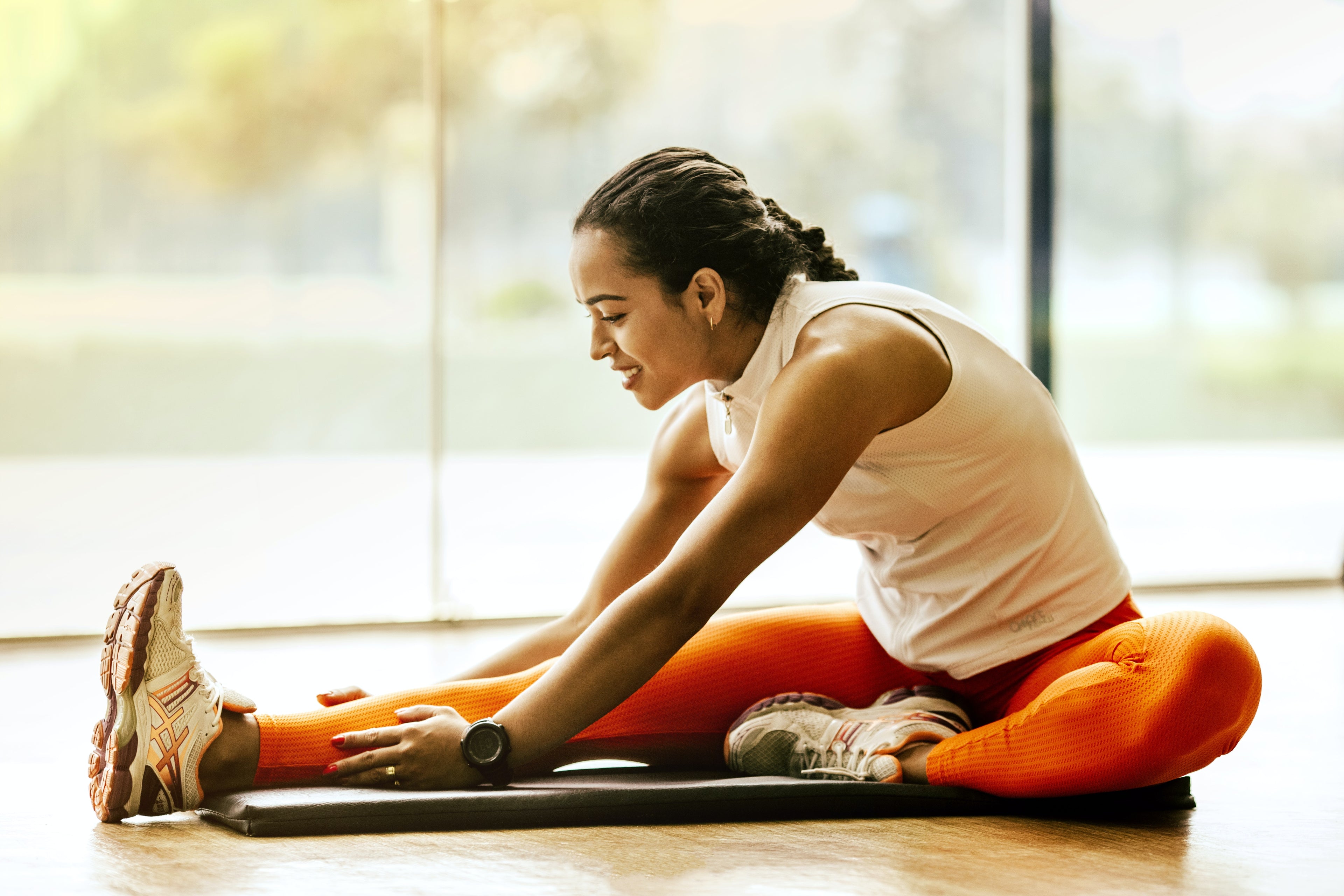 woman stretching Courage and Grace Bodycare